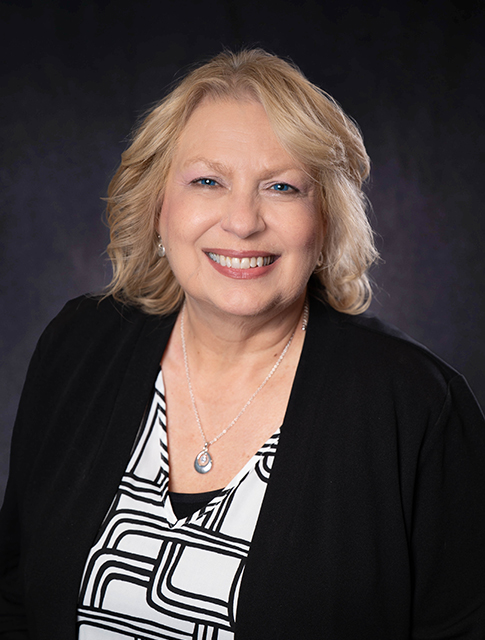 Dee Ann Bauguss smiling for the camera